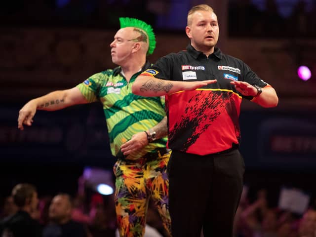Dimitri Van den Bergh defeated reigning champion Peter Wright Picture: Taylor Lanning/PDC