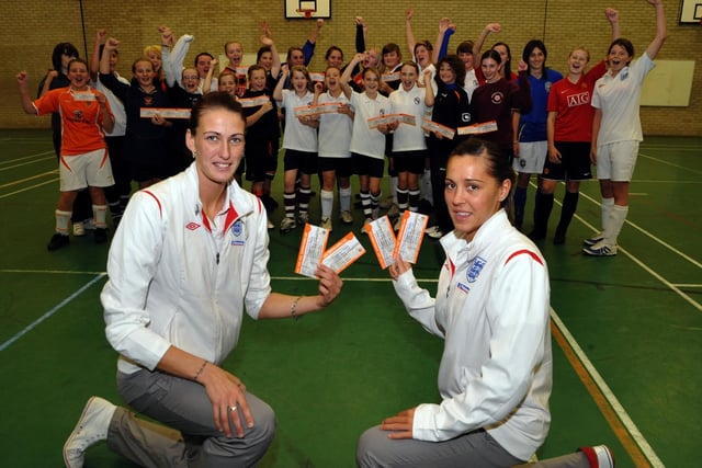 England women's footballers Jill Scott (left) and Fara Williams with pupils at Montgomery High School. Can anyone remember the event?