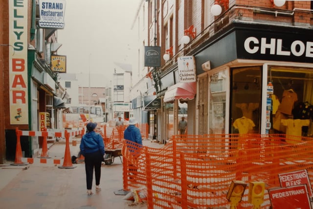 The Strand in 1993. Chloe, a women's fashion store on the corner with Kelly's Bar to the left and Strand Restaurant