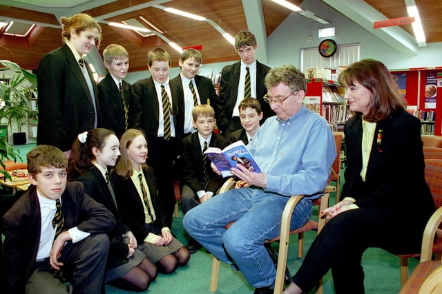 Author Nigel Hinton, creator of Buddy and Buddy's Song, visited Lytham St Annes High School to talk to pupils about writing.
Pic shows Nigel reading from one of his books, with school librarian Penny Kaluza seated next to him, 1998