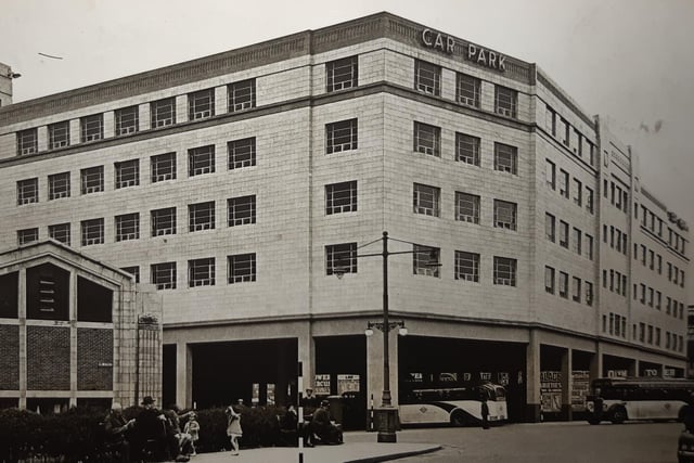 The caption on the back of this says 'The imposing dimensions of the new Bus Station are strikingly shown in this picture, in which the new St John's Market is also featured, 1938