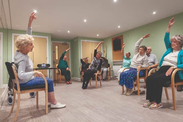 Homeowners take part in a weekly exercise class