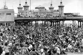 Thousands of beach lovers take to their deck chairs below Central Pier in 1965, when the summer show headliners were Bob Monkhouse, Mike Yarwood and Neville King