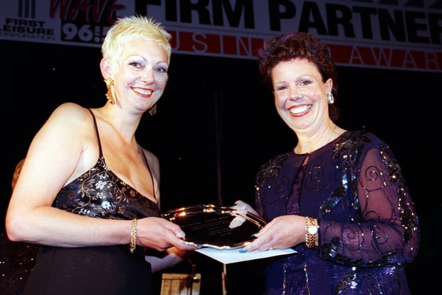 Christine Parker of Saks Hair and Beauty receives the Employee of the Year Award from Linda Beddowes of Fylde Office Services Bureau. This was in 1998 at the The Firm Partners Business Awards Ceremony