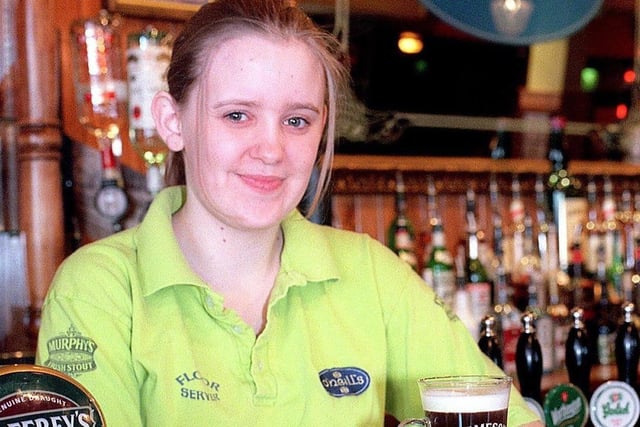 Vicki Turner serves up a tempting Irish coffee and chocolate truffle at O'Neill's in 2001