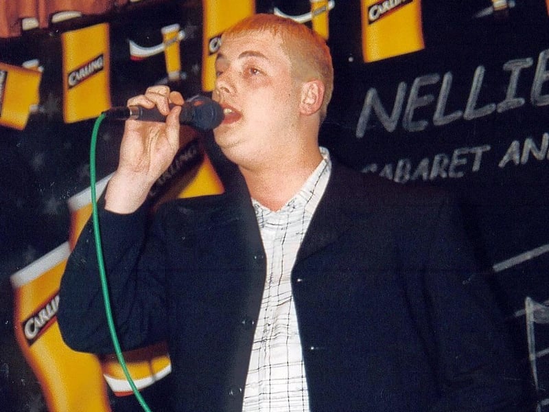 Andy Gardner in mid song at Nellie Dean's, 2002