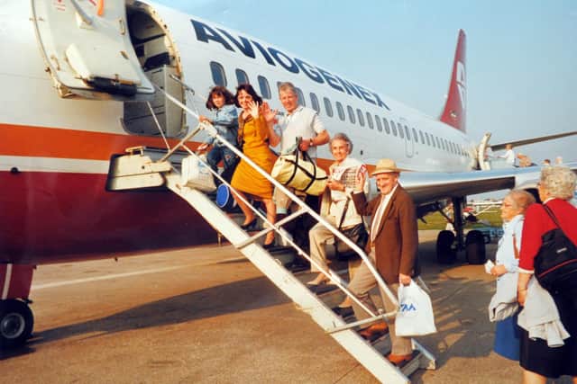 Happy holidaymakers board a Yugotours aircraft for its first flight out of Blackpool to Pula 1990