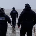 Police officers took part in an extensive search of the Morecambe Bay coast after human remains were found at the weekend.