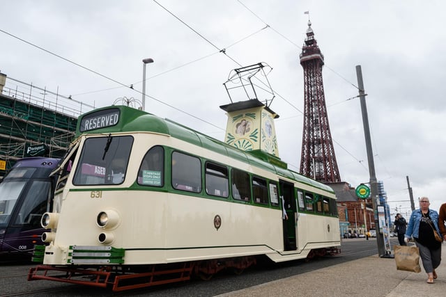 You see a green and white tram...
