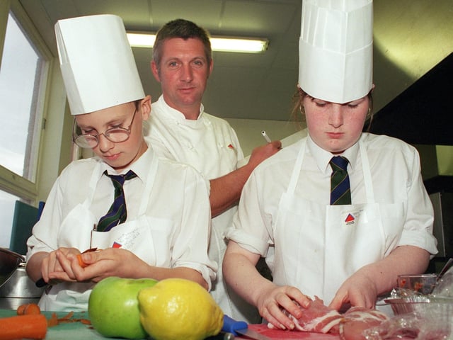 Young chef of the year competition at Blackpool and Fylde College, Bispham. Kristopher Evans (13) and Stacey Naylor (13) from Highfield High School prepare their meal under the watchful eye of judge, Michael Golowitz from Septembers brasserie, 1998