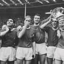 Manchester United players after winning the 1963 FA Cup Final against Leicester City at Wembley Stadium in London, UK, 25th May 1963. United won 3-1. 
From left to right, Tony Dunne, Bobby Charlton, team captain Noel Cantwell, Pat Crerand, Albert Quixall, David Herd and Johnny Giles (far right). (Photo by Evening Standard/Hulton Archive/Getty Images)