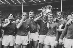 Manchester United players after winning the 1963 FA Cup Final against Leicester City at Wembley Stadium in London, UK, 25th May 1963. United won 3-1. 
From left to right, Tony Dunne, Bobby Charlton, team captain Noel Cantwell, Pat Crerand, Albert Quixall, David Herd and Johnny Giles (far right). (Photo by Evening Standard/Hulton Archive/Getty Images)