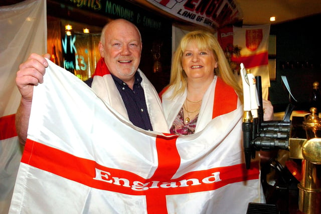 Landlord and Landlady Tony and Liz Baynes at The Links pub in St Annes. The couple decorated the bar with St George flags to celebrate St Georges Day, 2005