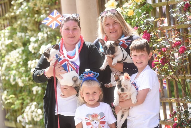 Sarah Williamson and Vicky Hepworth with children Isabelle Hepworth, Charlie Williamson and dogs Mario, Mirabel and Lexi at the jubilee party