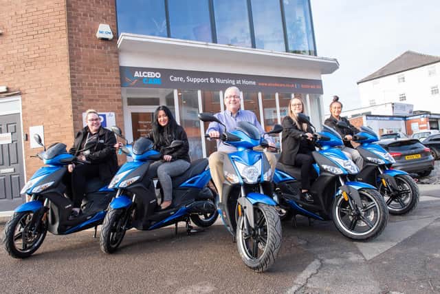 Alcedo Care has bought mopeds to help tits staff get around to visit their care clients, L to R Robyn Bamber, Holly Beddoe, Andy Boardman, Vanessa Collins and Sophie Emmerson