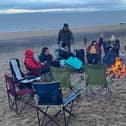 A fire kept the chills at bay for Jane Couch and members of the aptly-named women's group the Chill Lounge during their overnight beach event on Friday October 31.