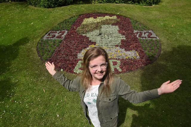 Amy Connolly with the floral clock at Stanley Park