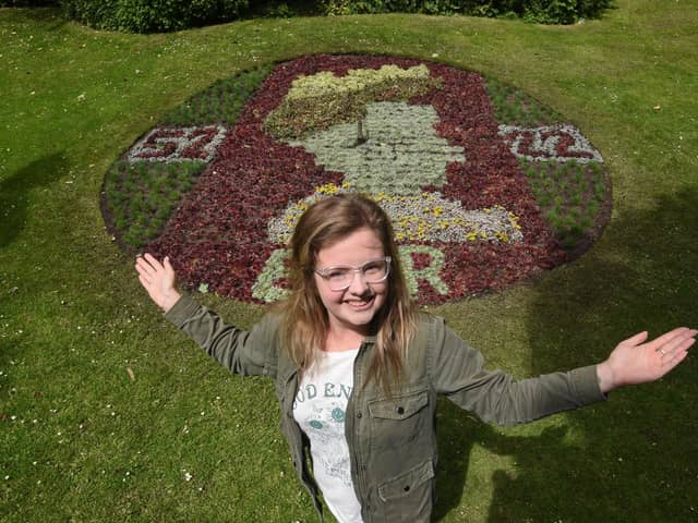 Amy Connolly with the floral clock at Stanley Park