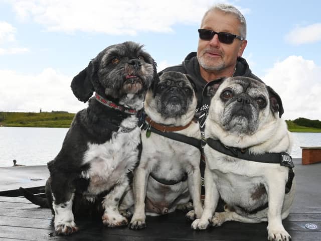 Colin Ballance with dogs Vincent, Presley and Percy.