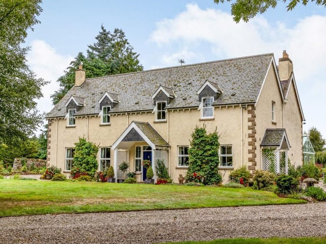 The property has a private driveway and turning circle.