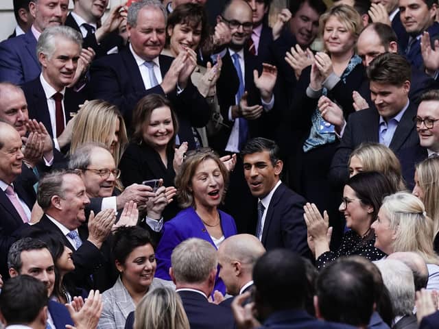 Rishi Sunak is congratulated as he arrives at Conservative party HQ in Westminster, London, after it was announced he will become the new leader of the Conservative party after rival Penny Mordaunt dropped out.