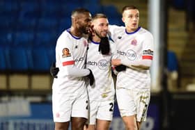 ​The Coasters celebrate their opening goal by Tyler Roberts (centre) at Halifax Photo: AFC FYLDE