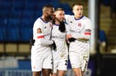​The Coasters celebrate their opening goal by Tyler Roberts (centre) at Halifax Photo: AFC FYLDE