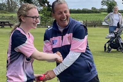 Bobbi Campbell receives the match ball from Blackpool CC Ladies' head coach Roger Garlick after taking five wickets in the T20 win over Shireshead and Forton