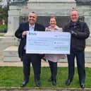 St Annes Enterprise chairman Veil Kirk (left) and vice-chairman Aileen Ames are presented with an Additional Restrictions Grant cheque for £30,000 by Fylde Council's deputy leader Coun Roger Small