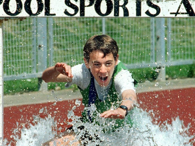 Blackpool Secondary Schools Athletic Association annual championship, held at Stanley Park Arena, Blackpool. Lee Halshaw (Highfield High School) on his way to winning the U16 Boys 1500m steeplechase in 1997