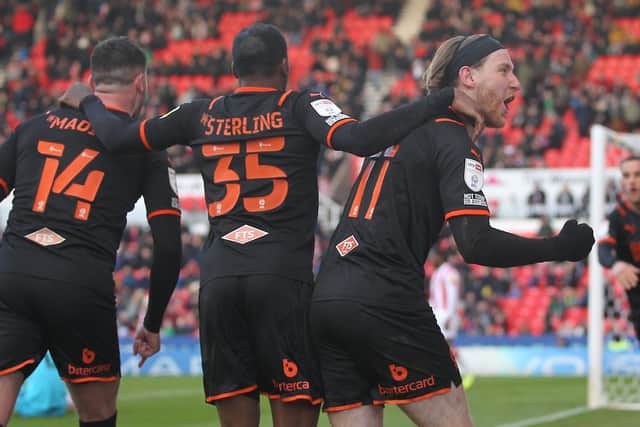 Josh Bowler is mobbed after scoring Blackpool's late winner