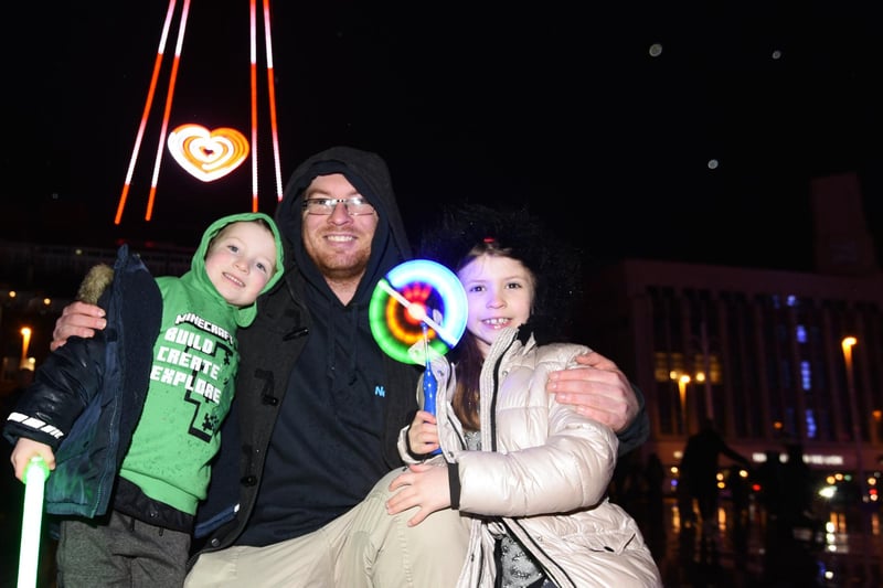 Chris Masters with Jacob, five, left, and Sophie, seven, right, enjoy The Carpet family party on Blackpool seafront
