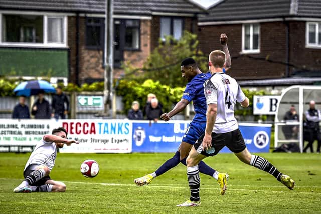 Gold Omotayo scores his second in Fylde's six-goal victory at Bamber Bridge  Picture: STEVE MCLELLAN