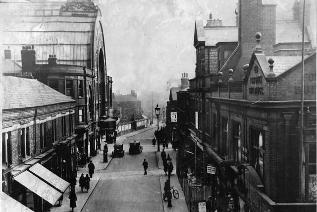Coronation Street as seen from Church Street in the 1930s with the Winter Gardens on the left. Today, the building on the right still bears the commemorative stone engraved with " Post Office Buildings" to indicate where the old post office once stood.