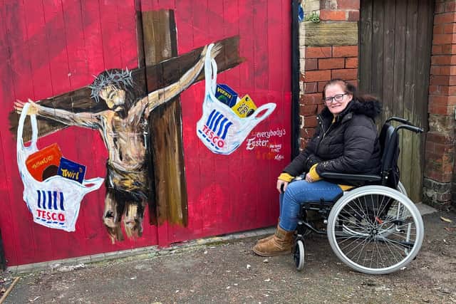 Kirsty Rea with an earlier mural, this time with an Easter theme
