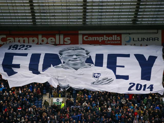 Preston North End fans with a Tom Finney surfer flag during their derby win over Blackpool.