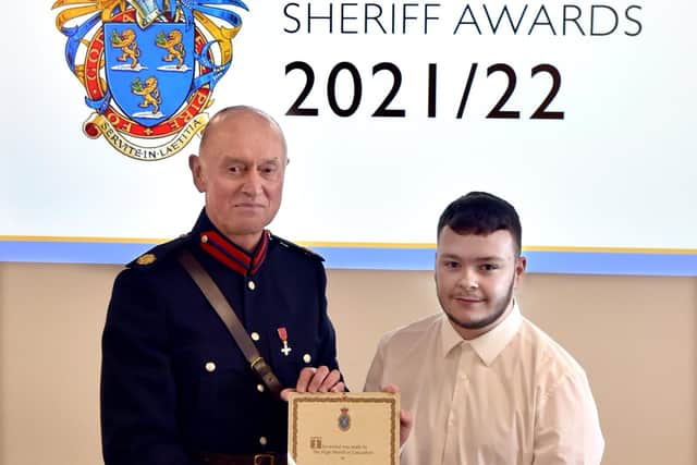 Alfie Goodwin receives his award