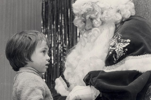 Three year old Charles Cochrane soon made friends with Father Christmas at the RHO Hills grotto when he visited him told him his hopes for Christmas gifts 1972