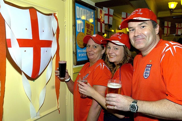 The Landlord of the Saddle Alan Bedford celebrates St Georges Day and his successful first month at the hostelry with staff Janet Ingleson (left) and Donna Taylor, 2005