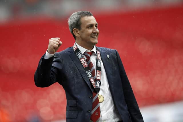 Andy Pilley celebrates Fleetwood's promotion to League One back in 2015
