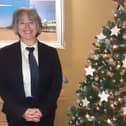 Funeral Arranger Carole Pickering with the branch memorial tree. Photo: e : J&A Porter Funeral Directors