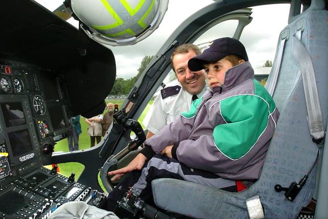 Eight-year-old Ryan Smallshaw from Pilling, in the cockpit of the police helicopter, with PC Ian Tyrrell at Lancashire Police Headquarters, Hutton