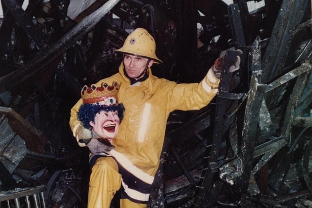 A massive blaze in December 1991 ripped through Blackpool’s Pleasure Beach, destroying the famous Fun House. A firefighter carries all that remianed of the laughing clown