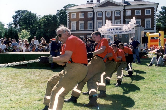 A team of firefighters from Lytham fire station tackle the tug-of-war at the Express Charity Gala