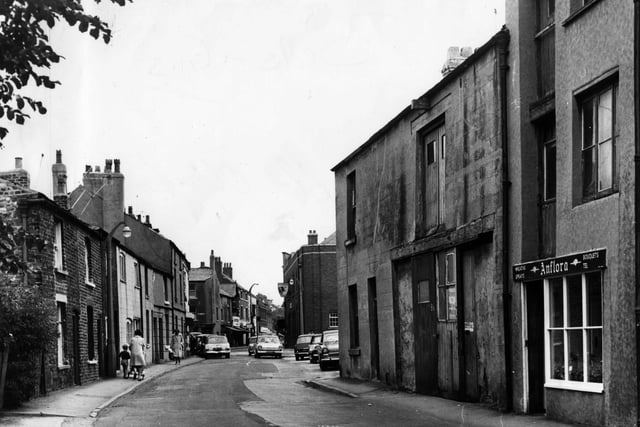 Blackpool Old Road looking towards the Market Place and Queens Square in 1968 before the one way traffic system. The building on the left on the corner of the Market Place was Richard's the ironmongers, which stocked everything that a farmer might need, plus domestic items. Next door on Blackpool Old Road was the Stocks Press and then the Old England Confectioners. Both were later demolished. The buildings on the right have been replaced with shops and offices, but the Bull Hotel is still a popular watering hole



 SPECIALS THEN AND NOW POSSS JACQ
Poulton / historical

Blackpool Old Road  looking towards the Market Place and Queens Square in 1968 before the one way traffic system. The building on the left on the corner of the Market Place was Richard's the ironmongers, which stocked everything that a farmer might need, plus domestic items. Next door on Blackpool Old Road was the Stocks Press and then the Old England Confectioners. Both were later demolished. The buildings on the right have been replaced with shops and offices, but the Bull Hotel is still a popular watering hole.