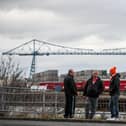 A Blackpool fan strikes up a conversation with Middlesbrough supporters before kick-off