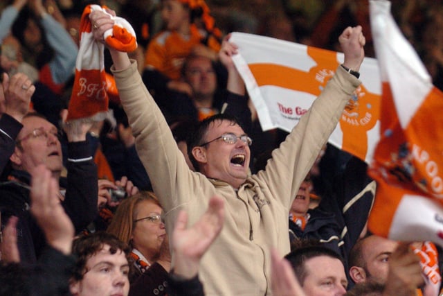 Supporters cheering on their team with passion during the Oldham play-off semi-final in 2007