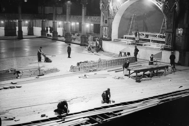 Workers laying a new floor in the Empress Ballroom at the Winter Gardens, Blackpool. A quarter of a million planks of wood were being fitted together onto joists supported by springs