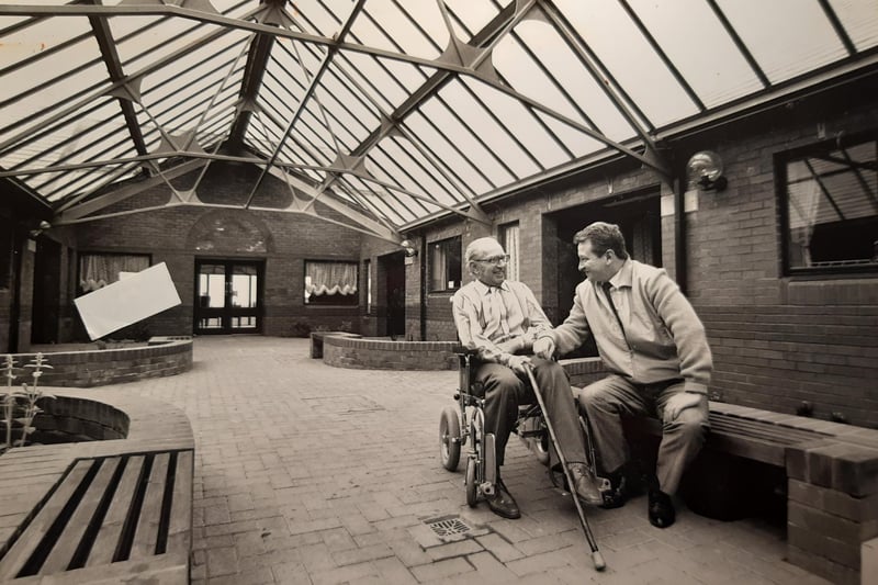 George Burrows and Joe Grundy in the covered patio area, 1988