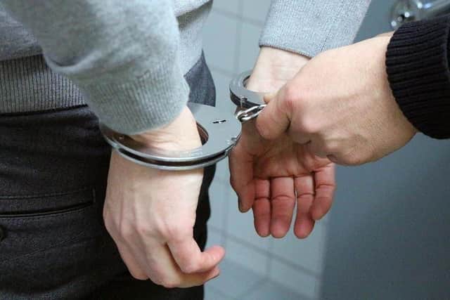 Two youths were arrested after a lit firework was thrown over a restaurant counter in Blackpool.
